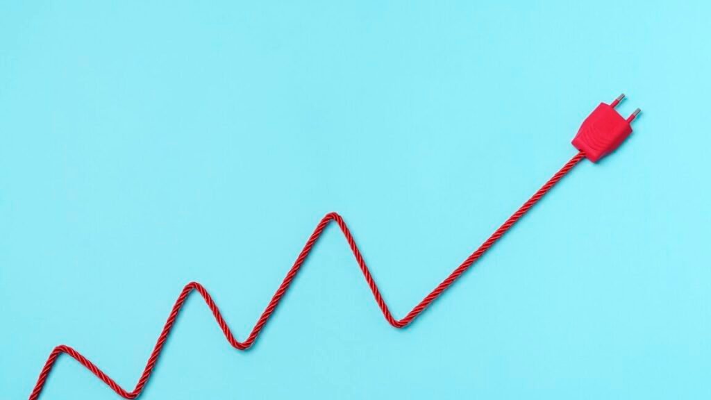 Why I’m withholding certainty that “precise” US cyber-op disrupted Venezuelan electricity red electric power plug on blue background. increase to electricity prices concept.