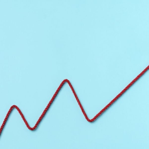 Red Electric Power Plug Adn cable forming a chart on blue background. Increase to electricity prices concept.